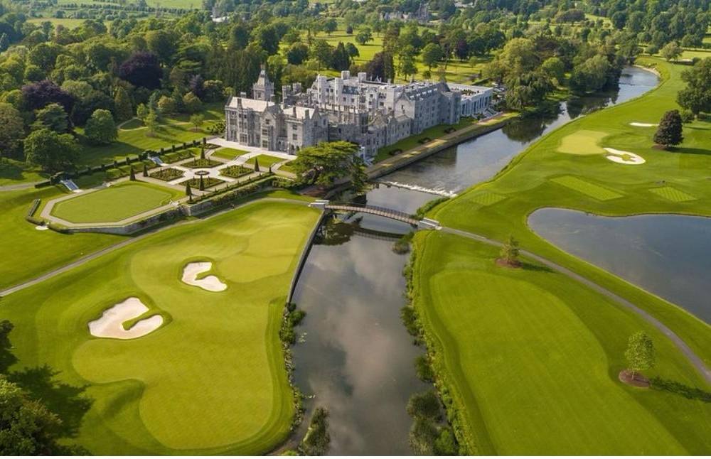 Aerial view of Adare Manor, its formal gardens and the golf course along the River Maigue, County Limerick